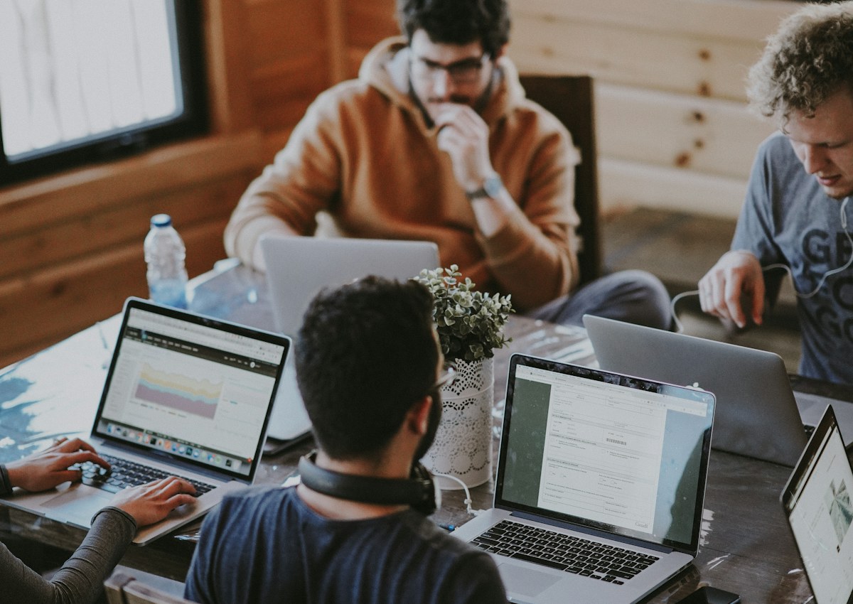 A team of professionals working together around a table